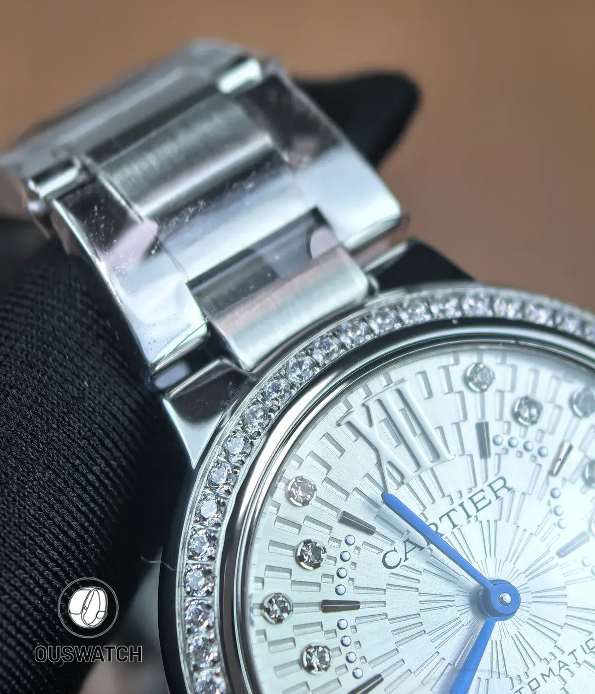 Shot displaying the stainless steel bracelet paired with the diamond-set bezel on the Ballon Bleu 33mm.
