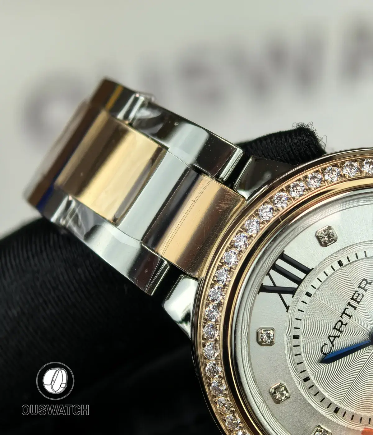 Inner-side view of the two-tone stainless steel and rose gold bracelet of the Cartier Iced Out Ballon Bleu 33mm.