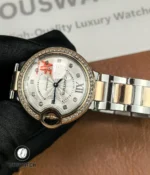 Full product shot of the Cartier Iced Out Ballon Bleu 33mm ladies watch showing dial, bezel, and bracelet.