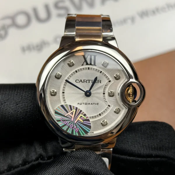 Front view of the Cartier iced-out two-tone Ballon Bleu women’s watch with a diamond-set dial and rose gold & stainless steel bracelet.