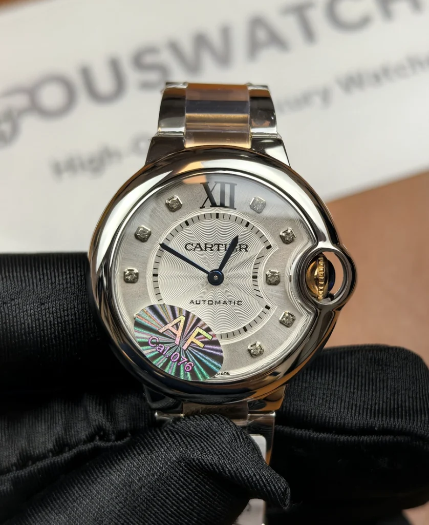 Front view of the Cartier iced-out two-tone Ballon Bleu women’s watch with a diamond-set dial and rose gold & stainless steel bracelet.