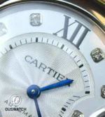 Macro of the diamond-set dial showing pavé diamonds, hour markers, and dial texture.