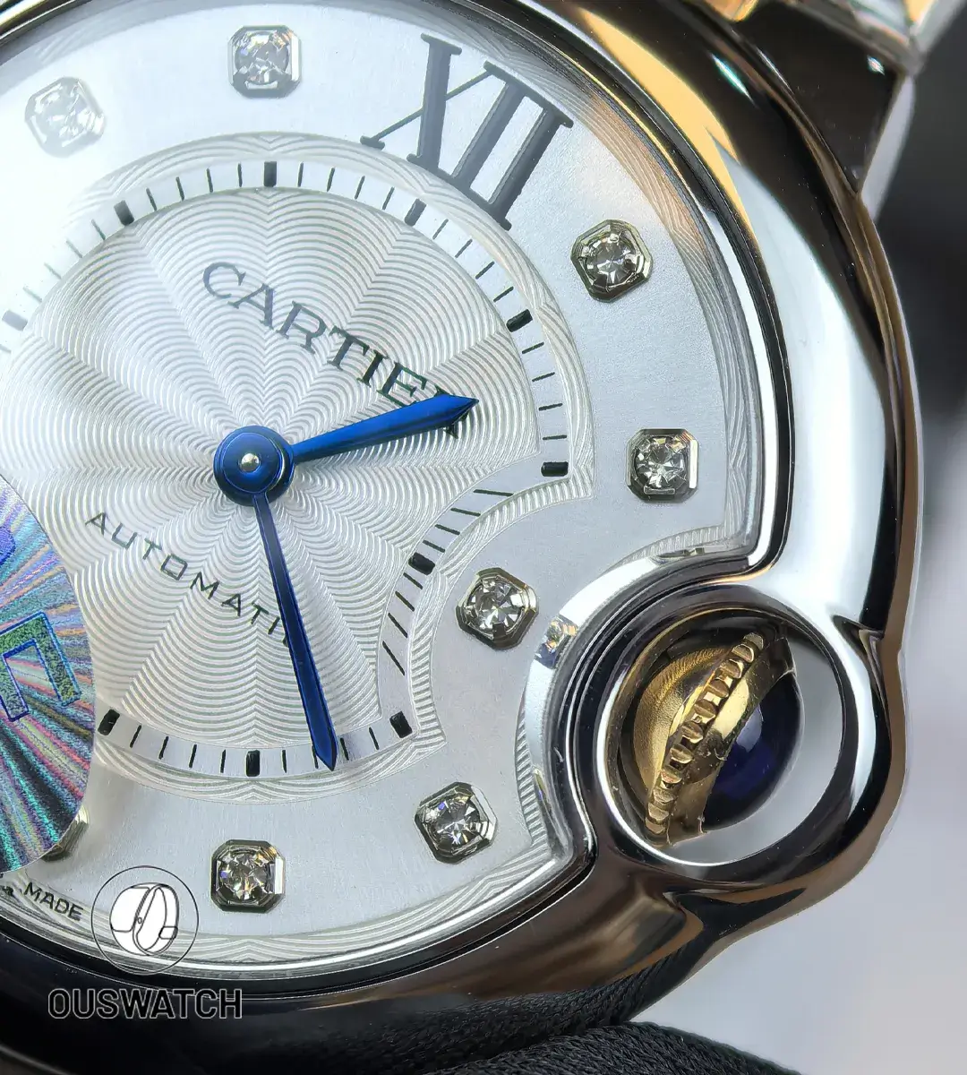 Close detail of the diamond dial alongside the crown assembly and surrounding casework.
