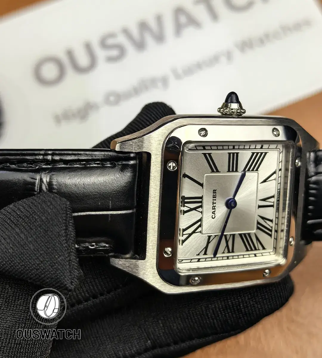 Watch lugs and attached black leather strap showing stitching and fit.