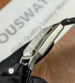 Side view of the stainless-steel case showing the brushed finish and crown profile.