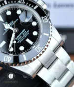 Close-up of the 41mm Rolex 126610LN black ceramic bezel, showing the engraved numerals and polished bezel edge