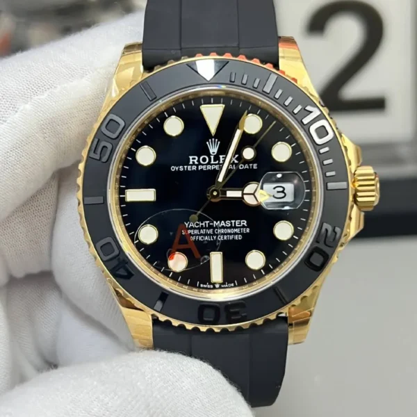 Front view of the Rolex Yacht-Master 42 super clone ref. 226658 with black dial, yellow-gold tone case, and Oysterflex-style strap.