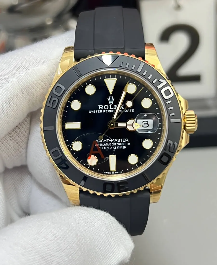 Rolex Yacht-Master 42 super clone ref 226658 black dial front view Front view of the Rolex Yacht-Master 42 super clone ref. 226658 with black dial, yellow-gold tone case, and Oysterflex-style strap.