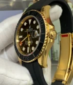 Close-up of the gold-tone bezel and crown on the Rolex Yacht-Master super clone, highlighting engraved bezel details and crown finishing.