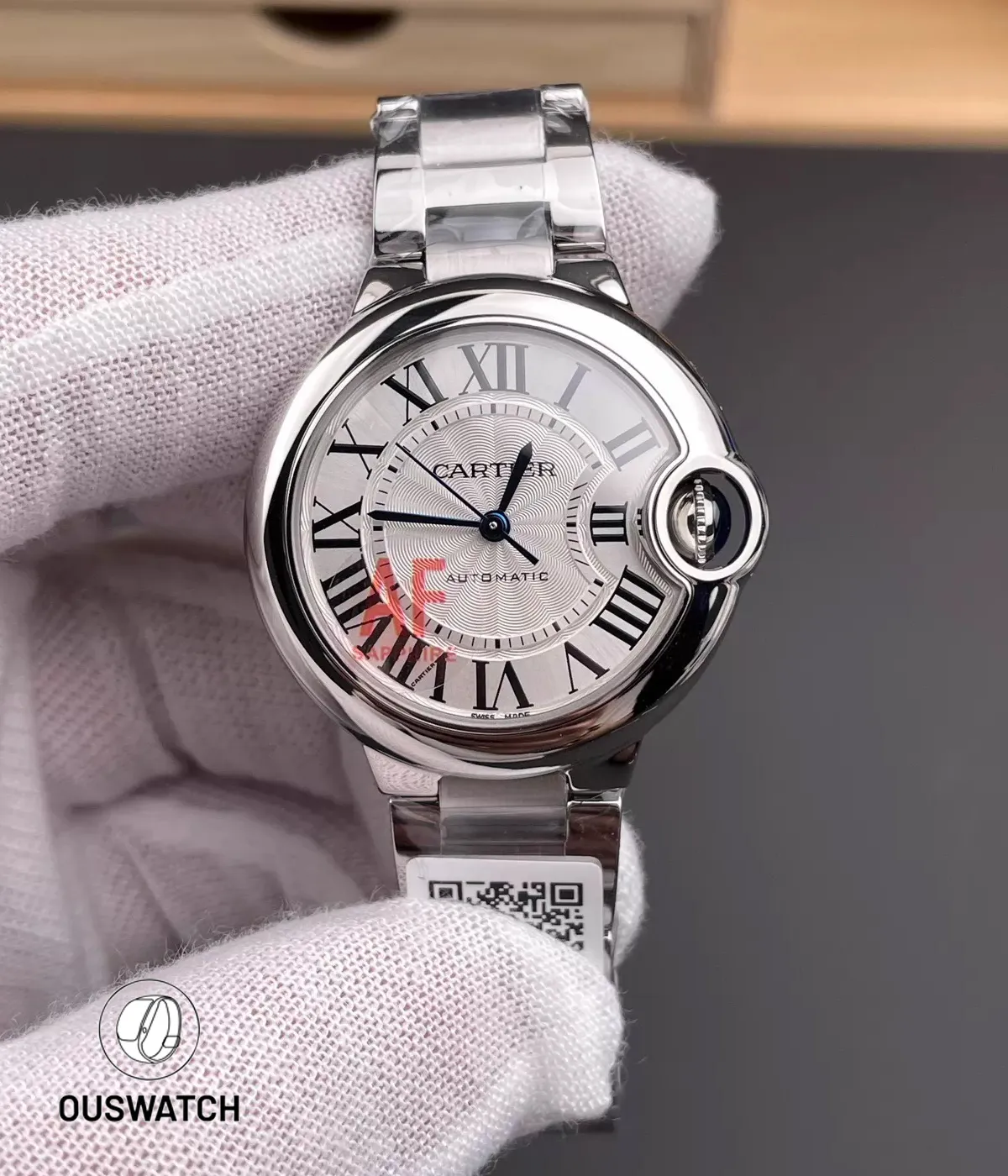 Front view of the super clone Cartier Ballon Bleu WSBB0044 in stainless steel, showcasing Roman numerals, sword-shaped hands, and a clean silver dial layout.