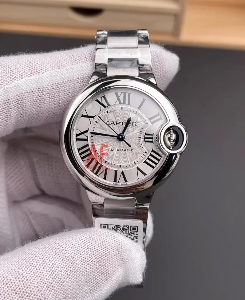 Super clone Cartier Ballon Bleu WSBB0044 33mm women’s stainless steel watch, featuring a polished round case, silver dial, and signature blue cabochon crown.