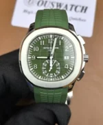 Front-facing image of the Patek Philippe Aquanaut 5968G-010, highlighting its rich green embossed dial, rounded octagonal bezel, and sporty chronograph layout.