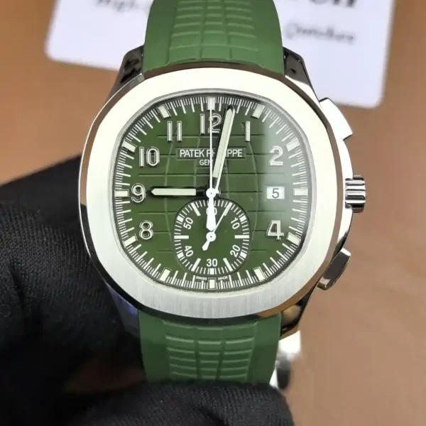 Front-facing image of the Patek Philippe Aquanaut 5968G-010, highlighting its rich green embossed dial, rounded octagonal bezel, and sporty chronograph layout.