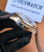 Focused side shot of the GMT adjustment pushers on the rose gold Aquanaut, illustrating the functional controls used for the dual-time setting.