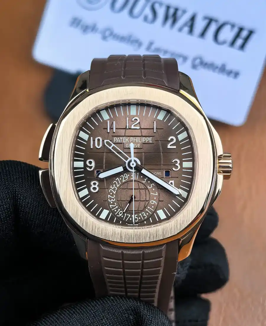Front-facing view of the Aquanaut Travel Time 5164R in rose gold, showcasing the brown dial, dual-time display, and the signature rounded octagonal case shape.