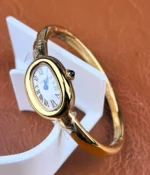Full view of the Cartier Mini Baignoire watch with bangle-style bracelet.
