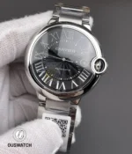 Front angled view showing the black dial, polished bezel, crown guard, and stainless steel bracelet.