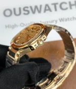 Side profile of the rose gold case and crown with polished finishing details.