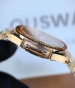 Side view of the rose gold watch case showing its slim profile and polished surfaces.