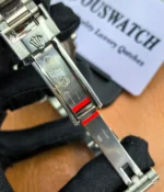 Open folding clasp display of the Rolex GMT-Master II 126719BLRO-0002 Oyster bracelet.
