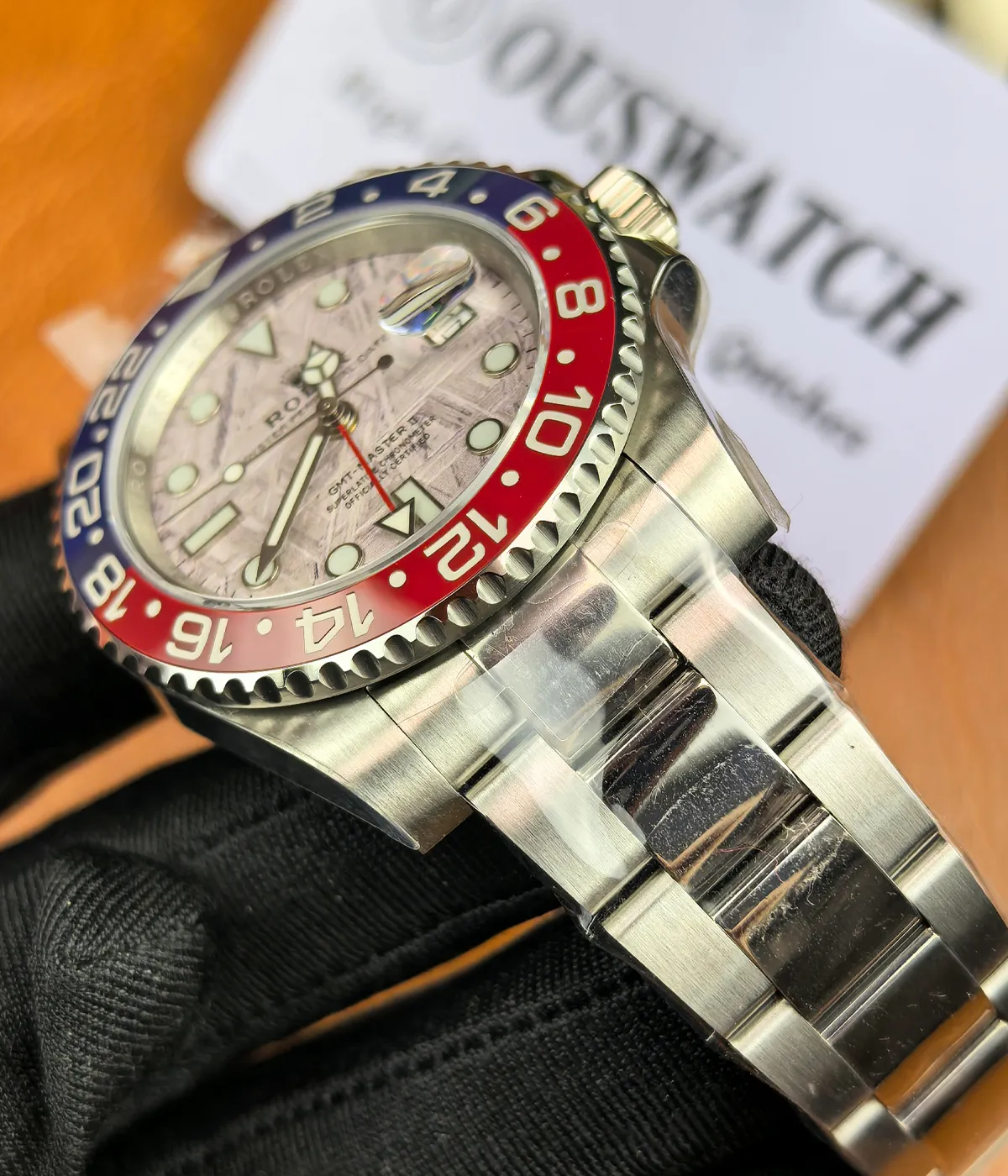 Detail view of the lugs and bracelet connection on the white gold Pepsi meteorite dial watch.