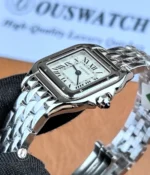 Close-up of the Cartier Panthère Small Watch bezel showcasing the polished stainless steel finishing and craftsmanship.