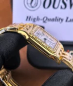 Side view of the Cartier WGPN0047 yellow gold case with refined polished detailing.