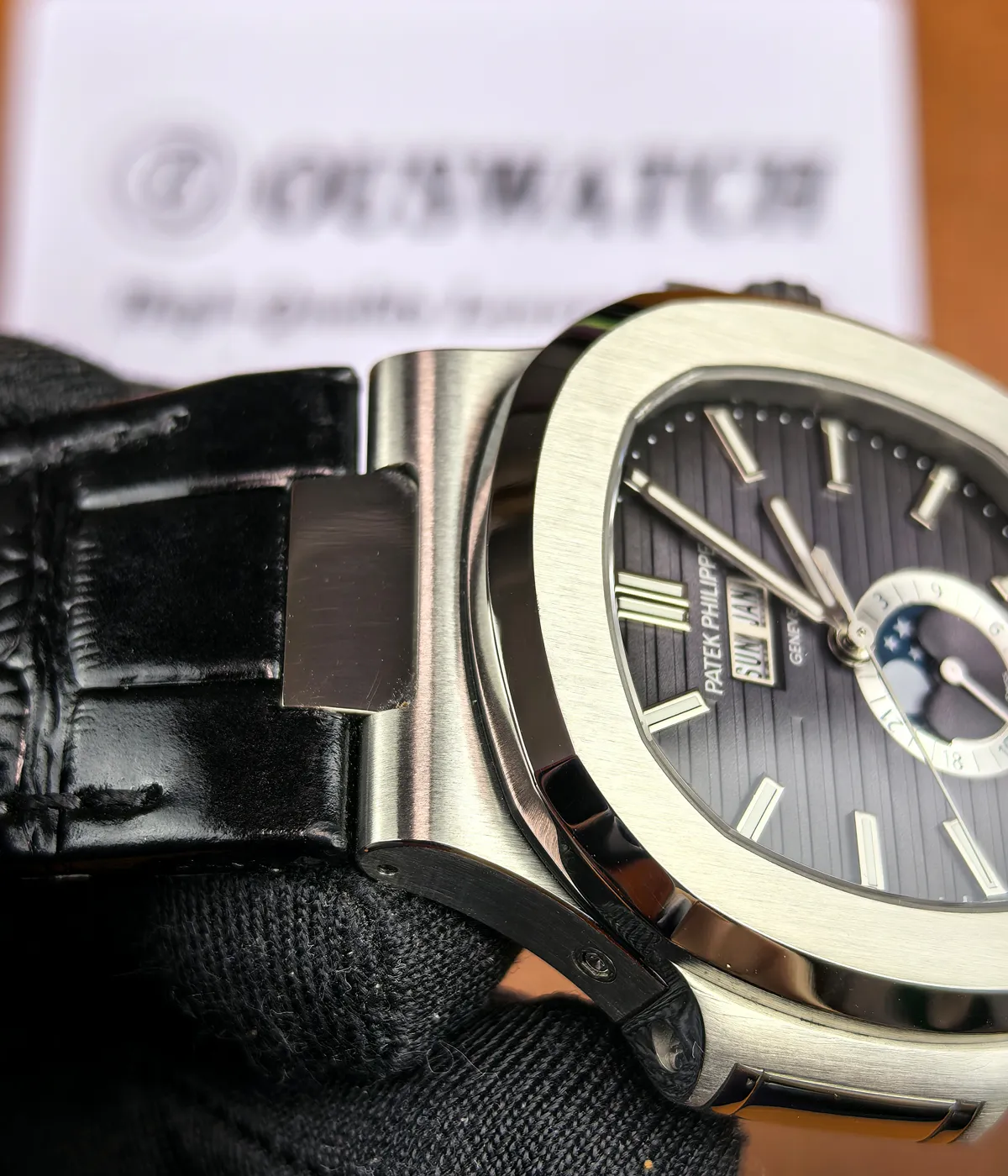 Annual Calendar detail on the super clone Patek Nautilus 5726A-001, focusing on the day-date-month windows and balanced dial symmetry.