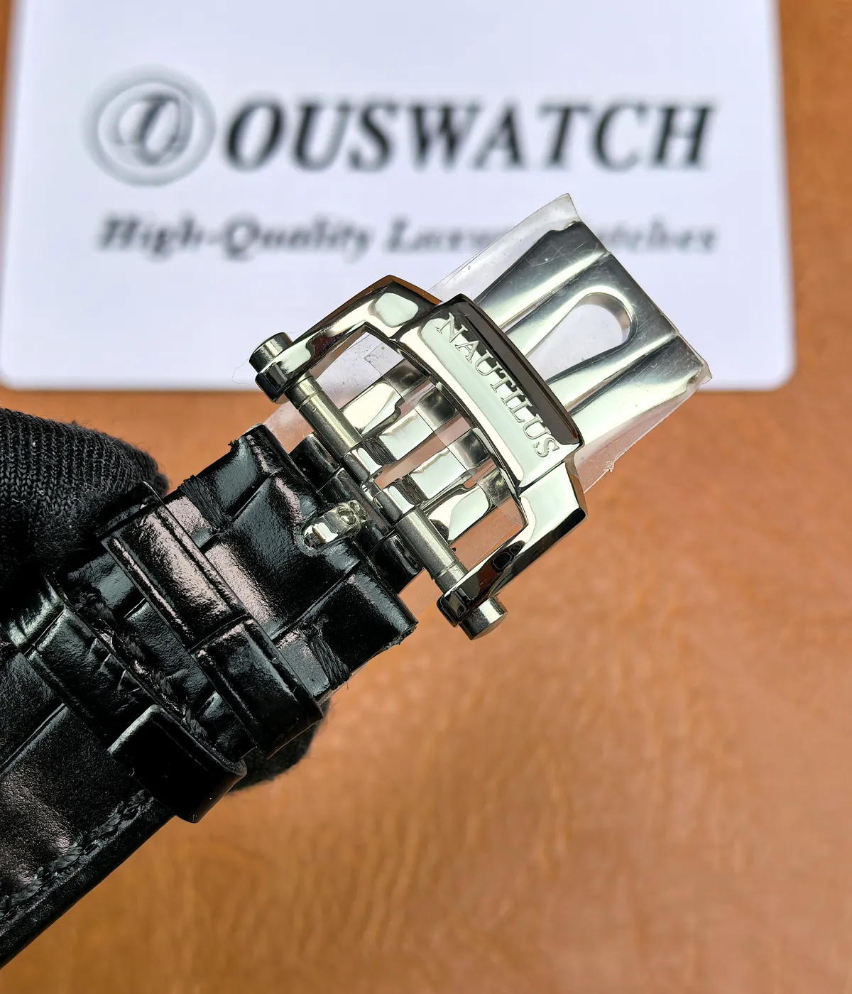 Leather strap detail of the super clone Patek Nautilus 5726A-001, featuring a textured black strap finish and clean stitching for a premium look.